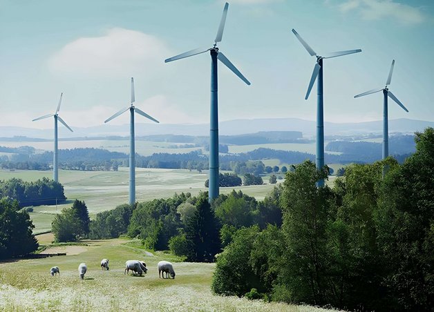 Bild zeigt Windräder umgeben von Feldern – Thema: alternative Energiequellen.